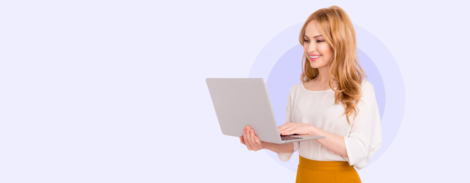 Homepage banner image of women smiling, while holding and looking at a laptop.