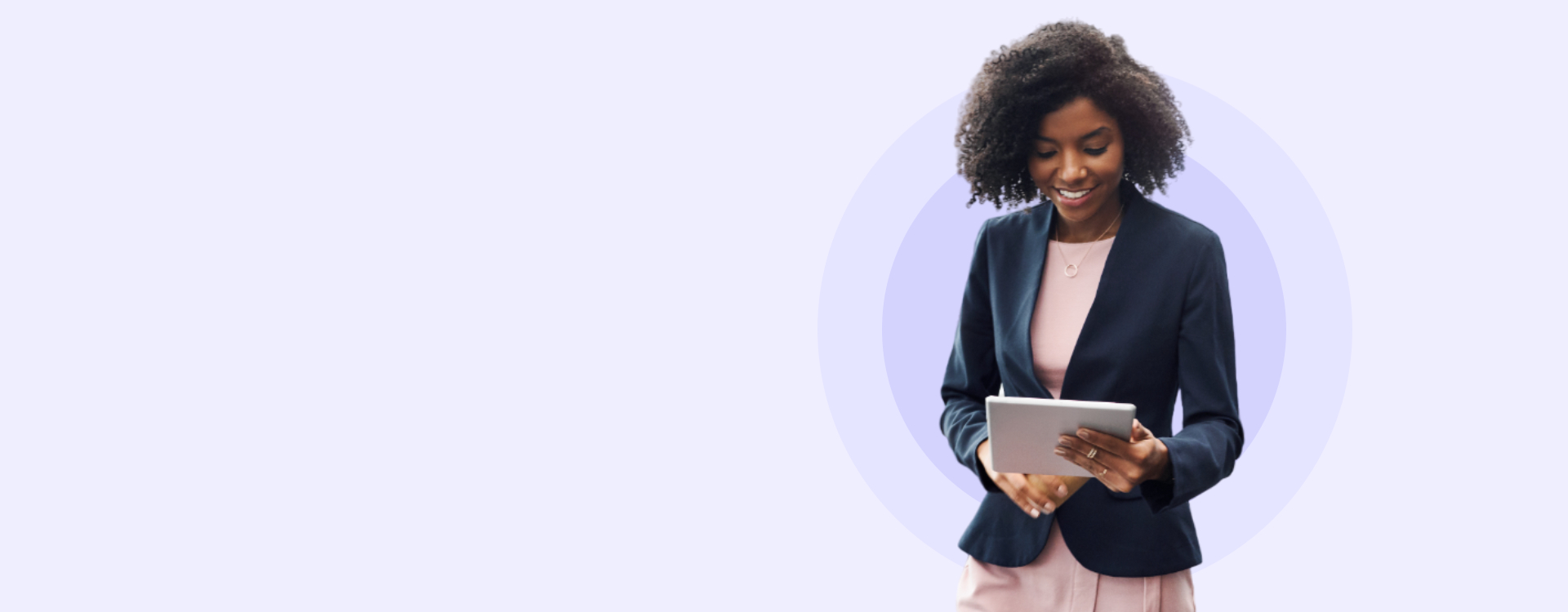 Young black business woman looking at tablet and smiling